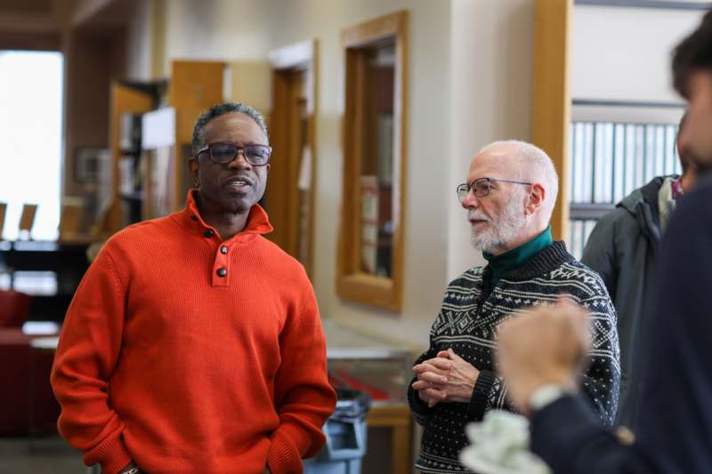 a group of men standing in a room