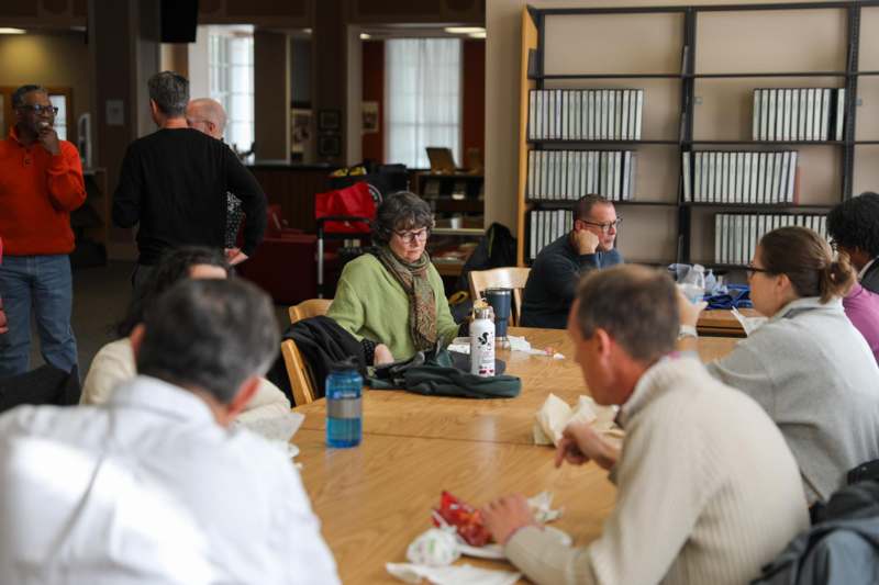 a group of people sitting at a table