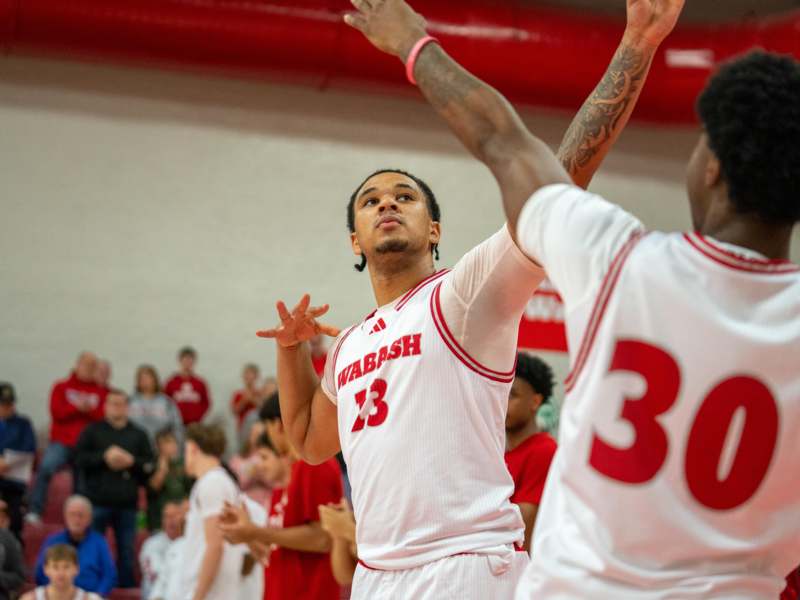 a basketball player in a white uniform