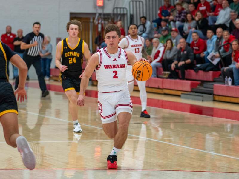a basketball player dribbling a ball