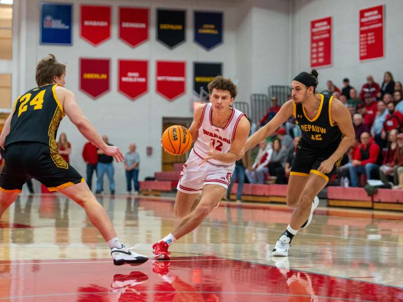 a group of men playing basketball