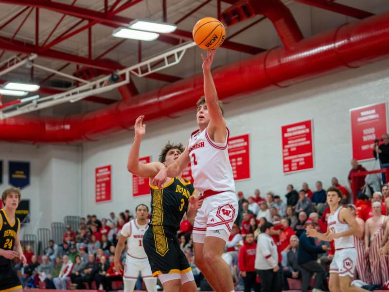 a group of men playing basketball
