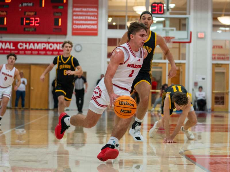 a group of men playing basketball