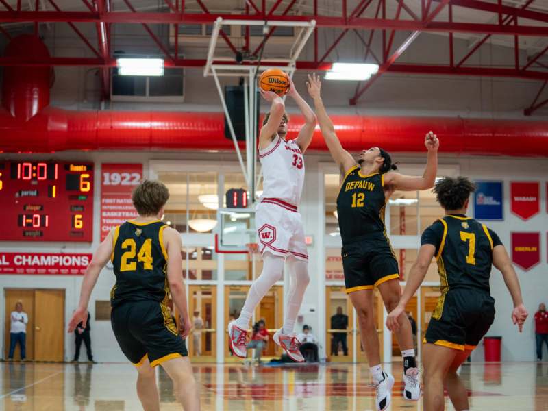 a group of people playing basketball