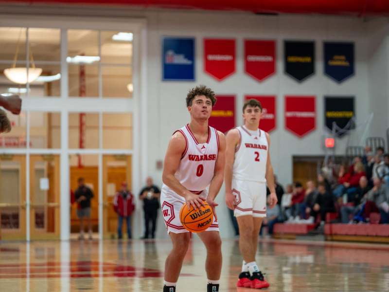 a basketball player holding a basketball