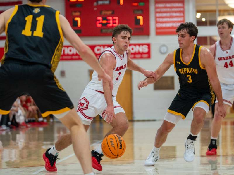 a group of men playing basketball