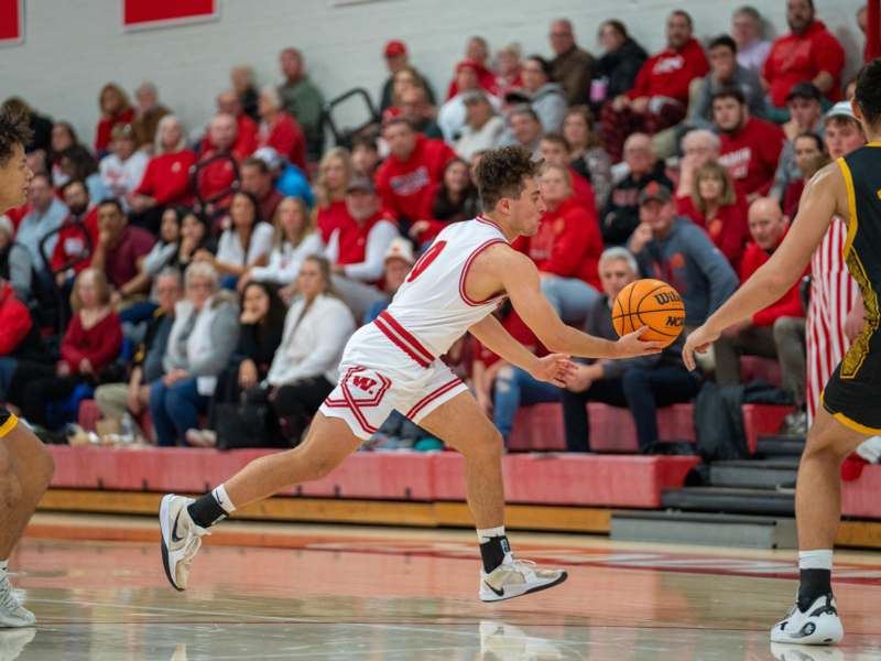 a basketball player dribbling a basketball