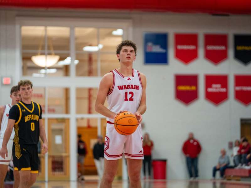 a basketball player holding a ball