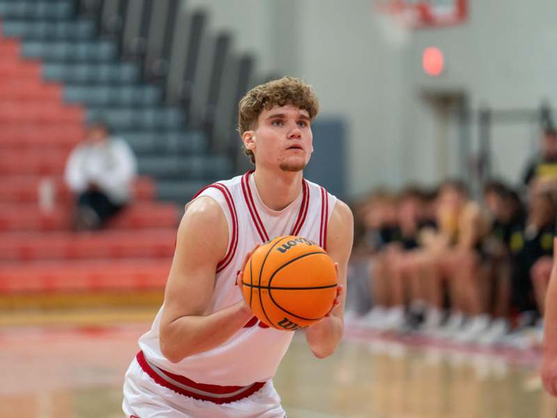 a man holding a basketball