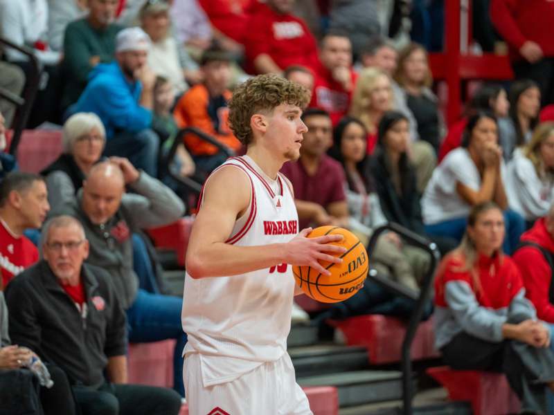 a man holding a basketball