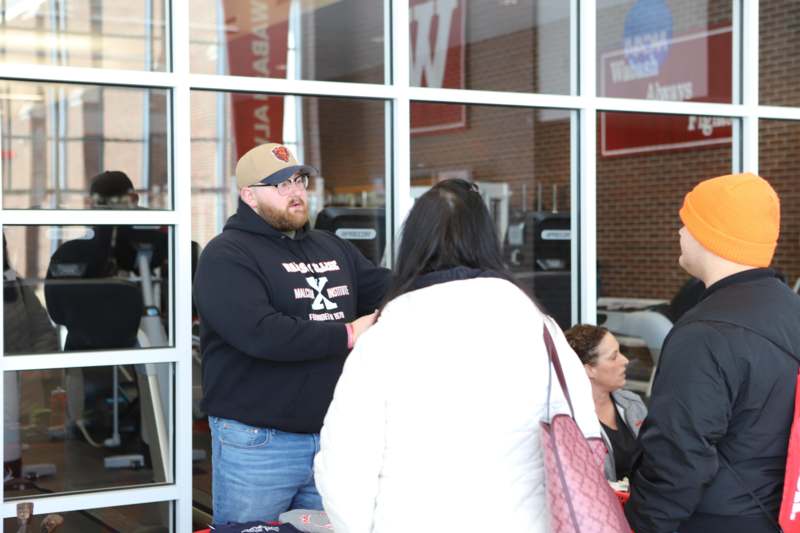 a man standing in front of a window