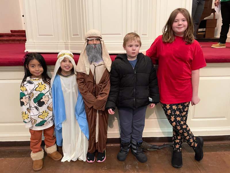 a group of kids posing for a photo