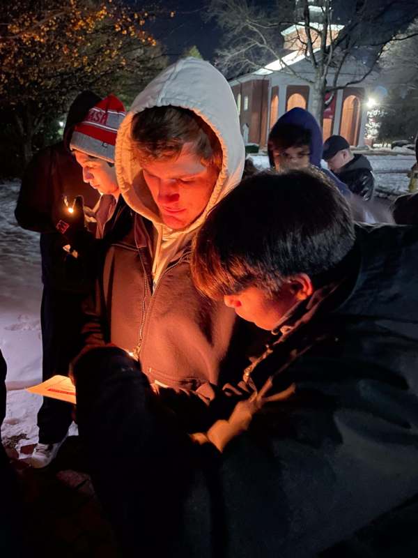 a group of people outside in the snow
