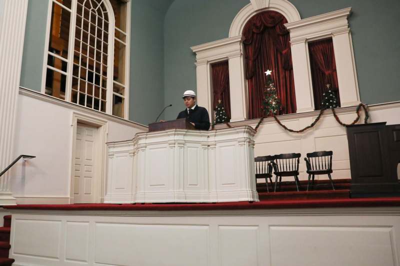 a man standing at a podium