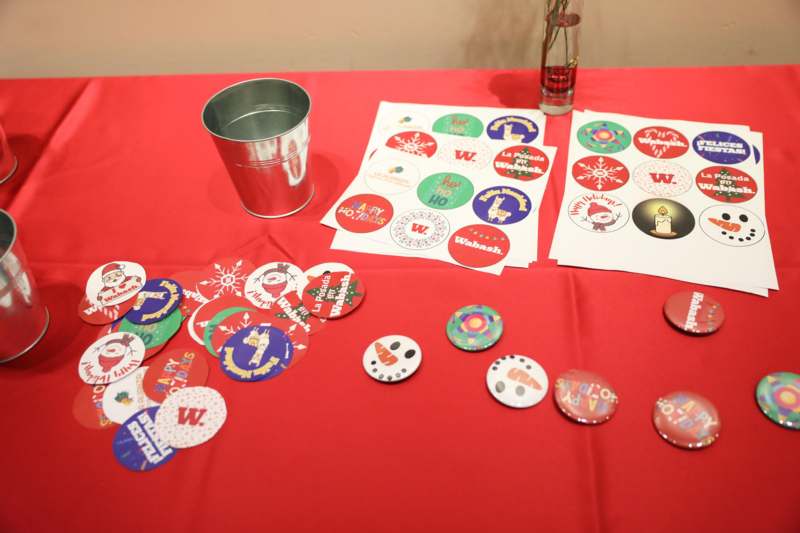 a table with a bucket and stickers