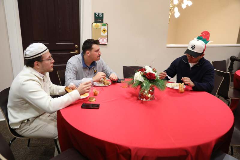 a group of men sitting at a table