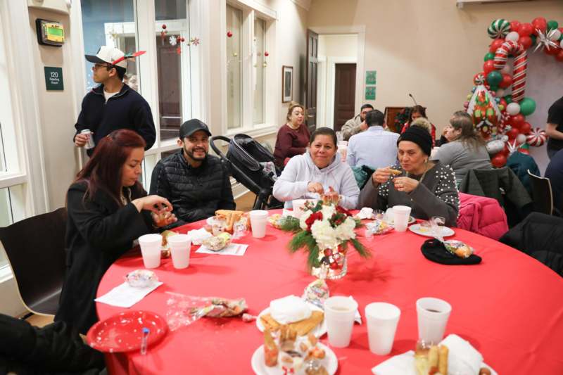 a group of people sitting around a table