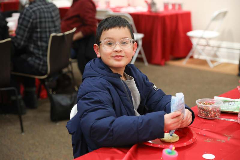 a boy sitting at a table