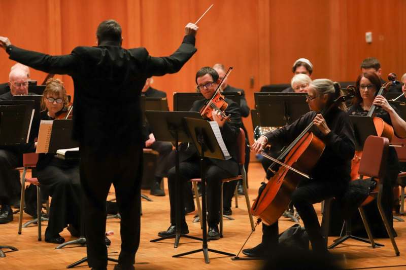 a group of people playing instruments