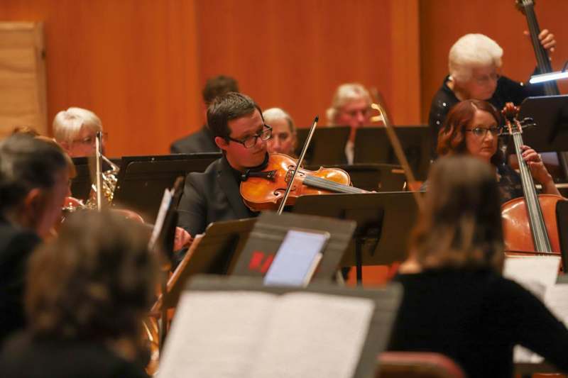 a man playing a violin