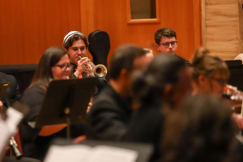 a group of people playing a trumpet
