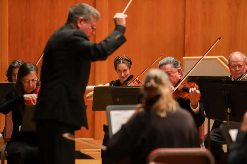 a group of people playing instruments