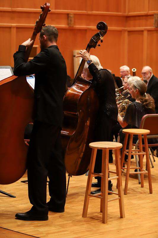 a man and woman playing a musical instrument