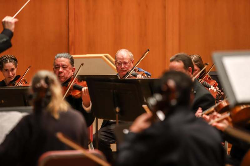 a group of people playing instruments