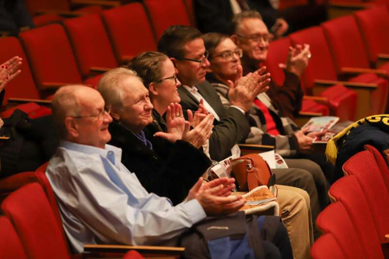a group of people clapping