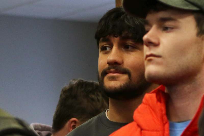 a group of men looking at each other