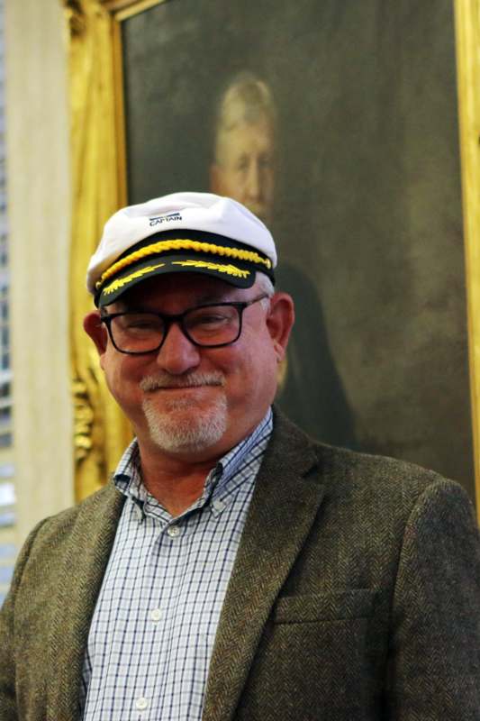 a man in a suit and hat