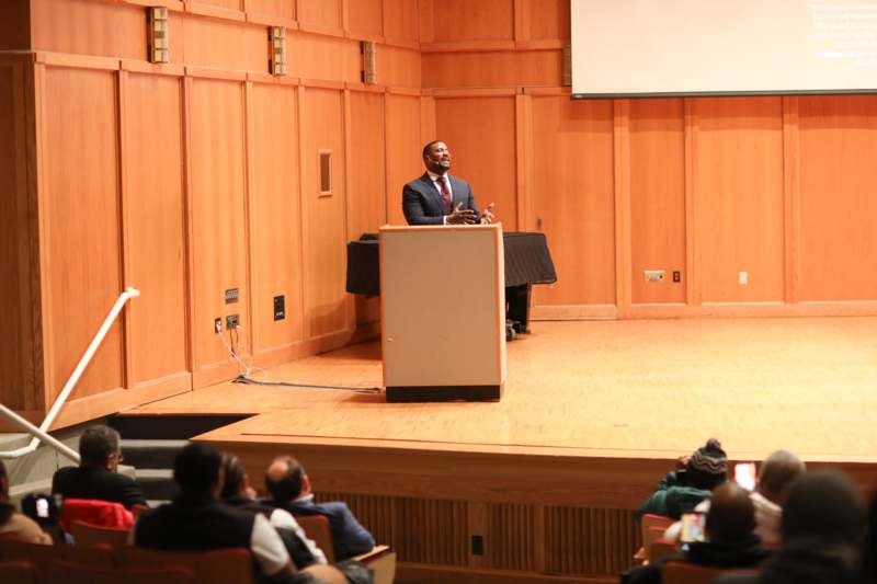 a man standing at a podium