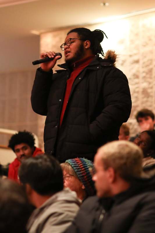 a man singing into a microphone
