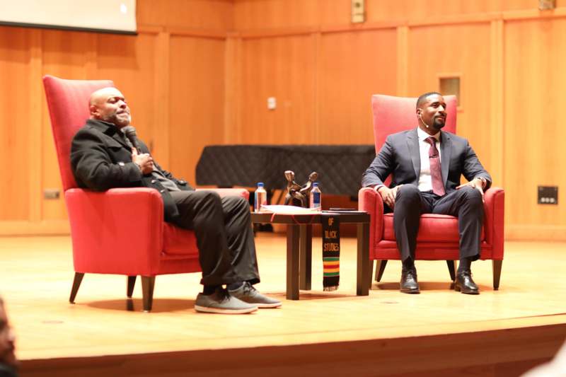 two men sitting in chairs