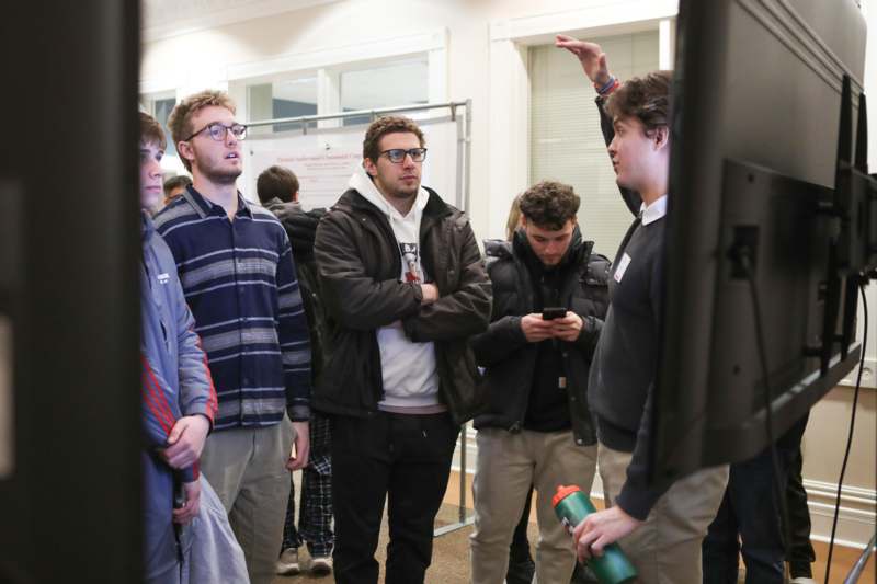 a group of people standing in a room