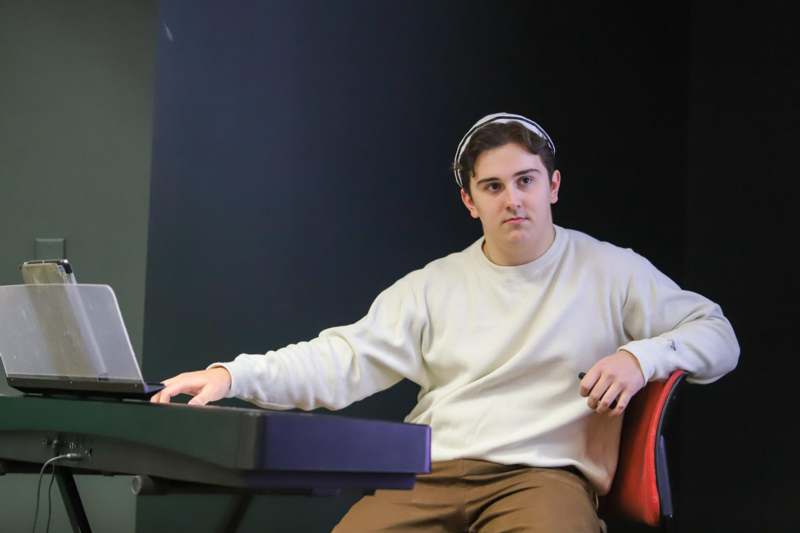 a man sitting at a piano