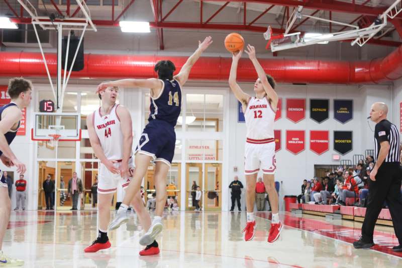 a group of men playing basketball