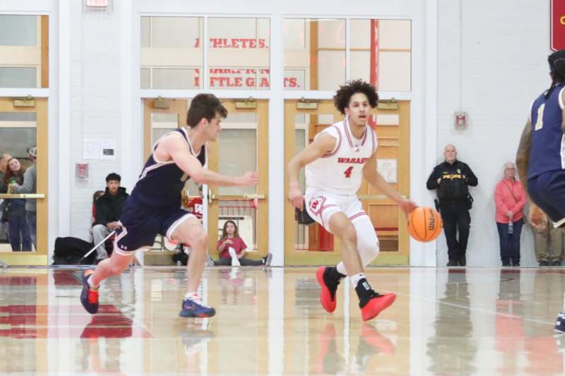 a group of men playing basketball