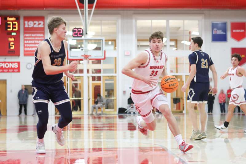 a group of men playing basketball
