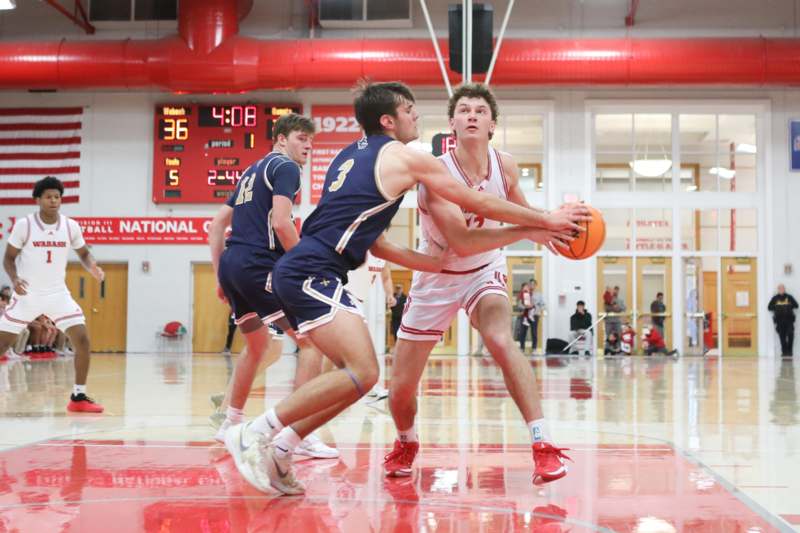 a group of men playing basketball