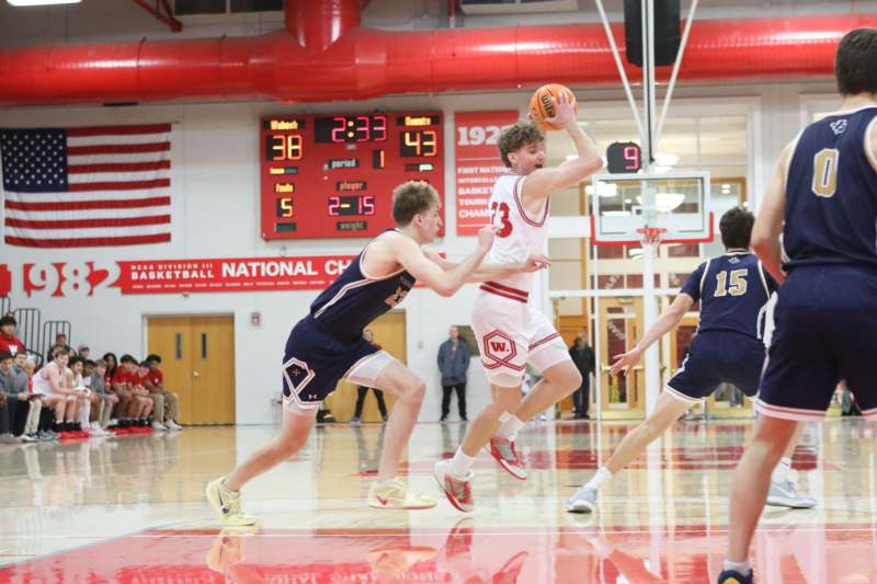 a group of men playing basketball
