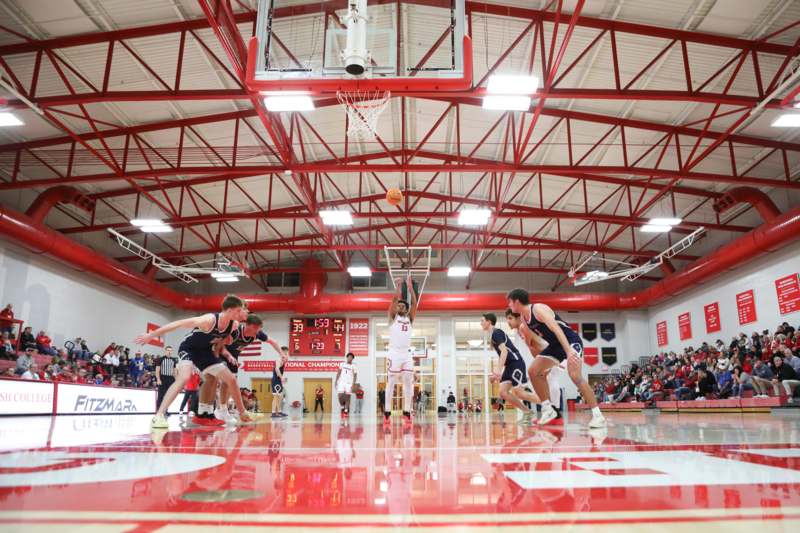 a group of men playing basketball