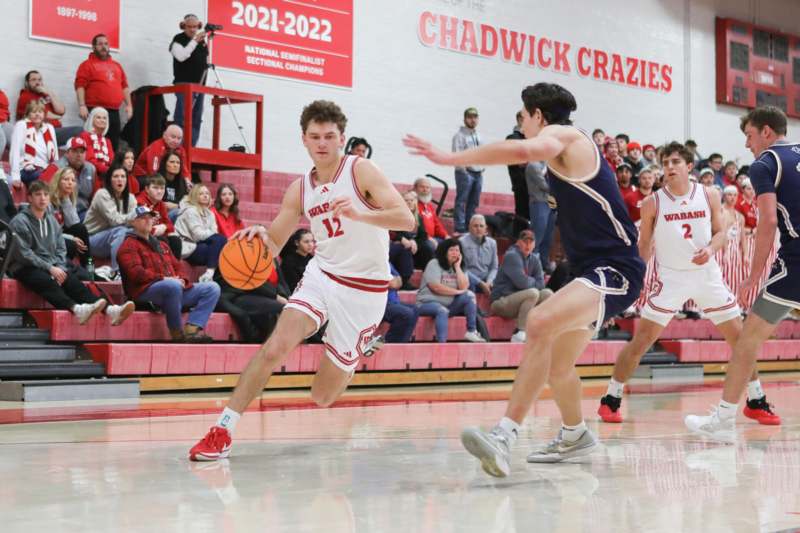 a group of men playing basketball