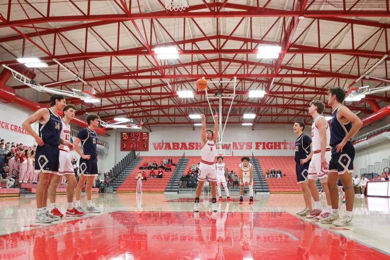 a group of people playing basketball