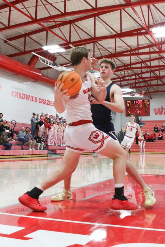 a man in a uniform playing basketball