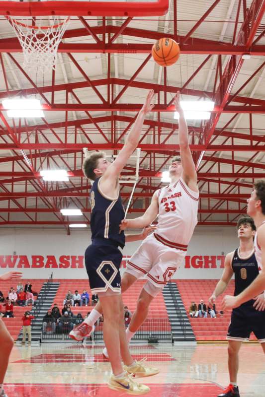 a group of men playing basketball