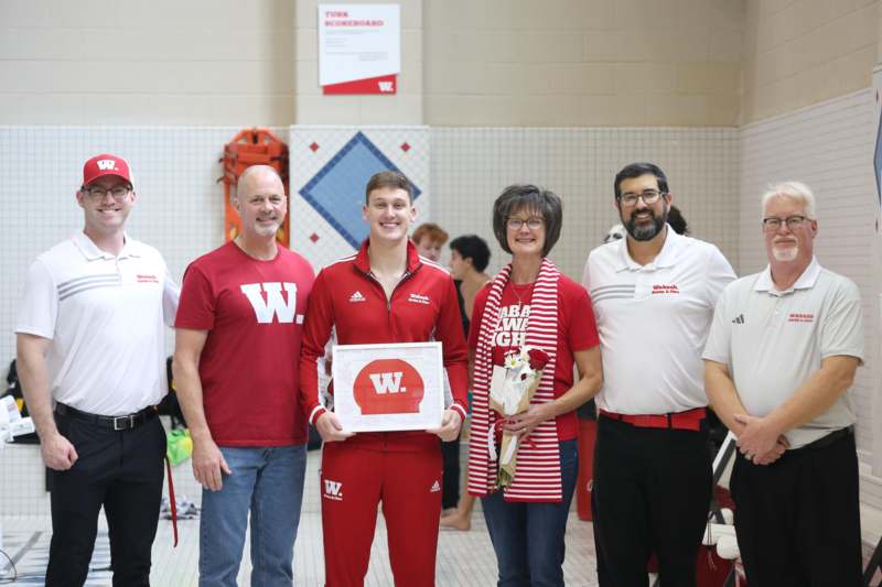 Swimming and Diving Seniors 2026 - a group of people posing for a photo