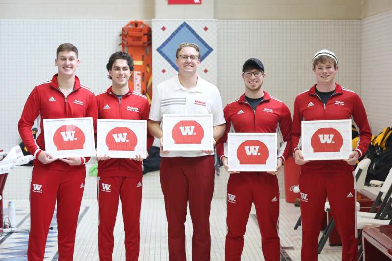a group of men holding signs
