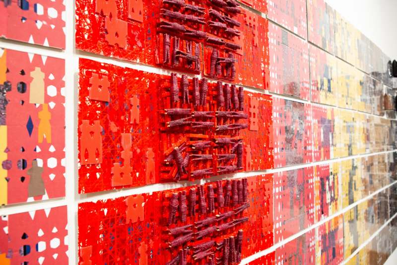 Akirash Art Exhibition Opening - a wall of red art pieces