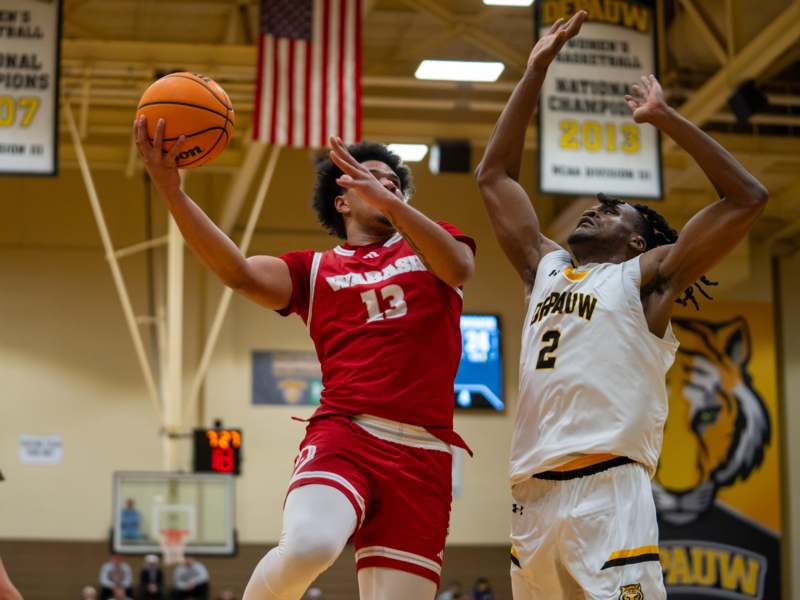 a group of men playing basketball
